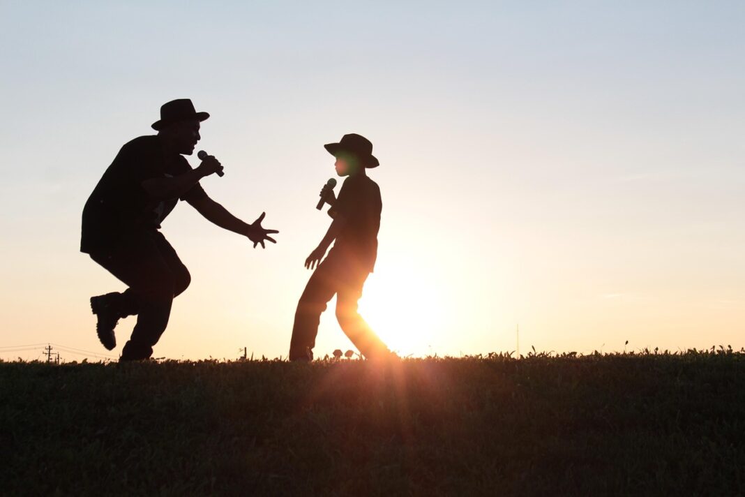 father and son, singing, sunset-3315817.jpg